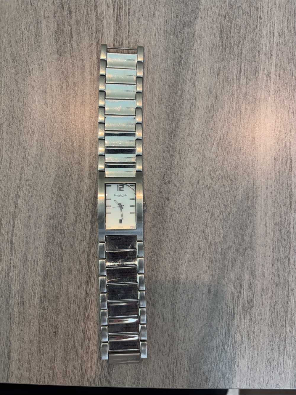 Kenneth Cole Men’s Silver Stainless Steel Rectangular Watch Glass crack on right
